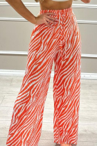 Orangefarbene Street-Print-Patchwork-Hose mit lockerer, hoher Taille und weitem Bein und vollem Print