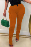 Pantalones de color sólido de color sólido con bolsillo de patchwork sólido de calle informal naranja