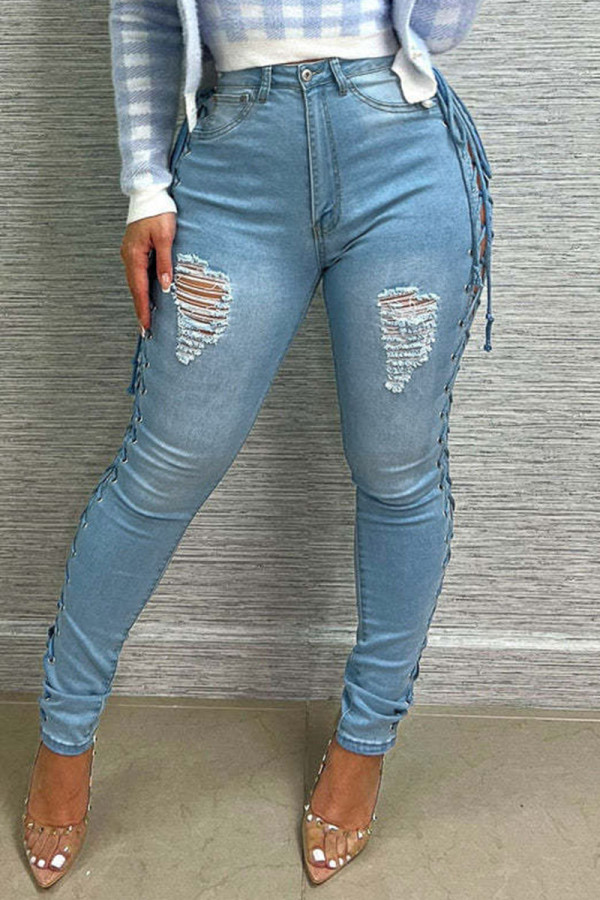 Jeans in denim a vita alta con patchwork strappati e fasciatura strappata azzurra sexy da strada