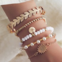 Conjunto de cinco piezas de pulseras de perlas macizas vintage de oro diario