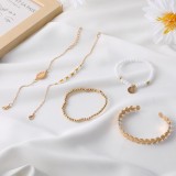 Conjunto de cinco piezas de pulseras de perlas macizas vintage de oro diario