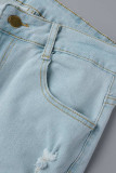 Il solido blu della strada casual strappato fa i vecchi jeans del denim della vita alta della rappezzatura