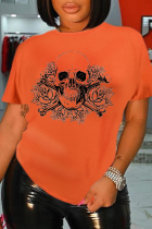 Camisetas laranja casual estampa patchwork com decote em caveira
