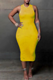 Vestidos de falda de un paso con cuello en O de patchwork rasgado sólido sexy amarillo