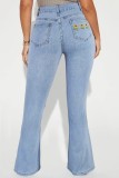 Jeans jeans regular liso azul claro bordado patchwork cintura alta