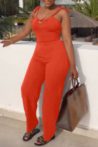 Tangerine Red Sexy Casual Solid Bandage Backless Spaghetti Strap Regular Jumpsuits