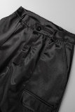 Pantalones casuales de color liso de cintura alta con bolsillo de retazos lisos en la calle negro