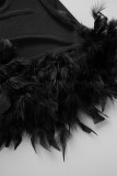 Svarta Sexiga Solid Patchwork Genomskinliga fjädrar Asymmetriska O-hals Oregelbundna klänningar
