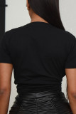 Camisetas casuais pretas com estampa diária de caveira patchwork letra O decote