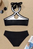 Schwarzer, sexy, gepunkteter Verband mit ausgehöhlten, rückenfreien Badeanzügen (mit Polsterungen)