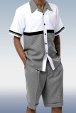 Conjunto de traje de caminar con estampado de manga corta de dos piezas en blanco y negro con pantalones cortos