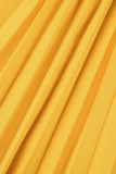 黄色のセクシーな固体包帯中空パッチワーク折りターンダウン襟ストレート ジャンプスーツ