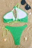 Grüne sexy feste Bandage ausgehöhlte rückenfreie Badebekleidung (mit Polsterungen)