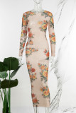Aprikos sexigt tryck genomskinliga o-halsade långärmade klänningar