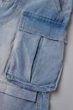 Hellblaue, lockere Street-Jeans mit Patchwork-Tasche und hoher Taille und allmählichem Wechsel