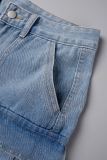 Blaue, lockere Street-Jeans mit Patchwork-Tasche und hoher Taille und allmählichem Wechsel
