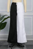 Pantalones de retazos rectos de cintura media sueltos con contraste de bolsillo abultado de color blanco negro