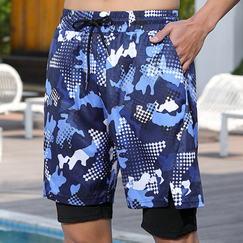 Bañador con bolsillo con cordón y diseño de patchwork con estampado de vacaciones en color azul