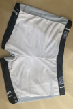 Calção de banho preto e branco com estampa de patchwork para roupas esportivas