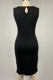 Schwarzes, lässiges, ausgehöhltes Patchwork-Kleid mit O-Ausschnitt und ärmellosem Print