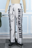 Pantalones flacos con estampado de borlas y letras de retazos de calle blanco