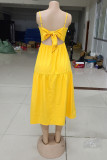 黄色のセクシーなカジュアルソリッドバックレススパゲッティストラップノースリーブドレス