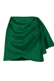 Fondo di colore solido asimmetrico a vita alta con patchwork di fasciatura solida verde sexy