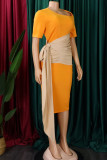 Vestidos de saia em um degrau amarelo casual com patchwork de retalhos dobrados assimétricos