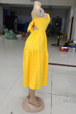 黄色のセクシーなカジュアルソリッドバックレススパゲッティストラップノースリーブドレス