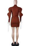 Coffee Sexy Solid Bandage Hollowed Out Patchwork Buckle Turn-back Collar One Step Skirt Dresses