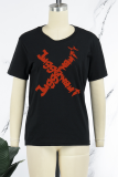 T-shirts met zwarte straatprint en patchwork met O-hals