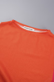 Orange-gelber, lässiger Patchwork-Plissee-Zweiteiler mit halbem Rollkragen und langen Ärmeln