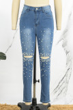 Jeans skinny azul médio casual com retalhos rasgados e miçangas de cintura alta (sujeito ao objeto real)