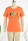 Camisetas casuais pretas laranja com estampa de rua patchwork com gola O