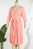Vestidos plisados ​​con cuello en V plisados ​​con cremallera de retales de vendaje liso elegante rosa
