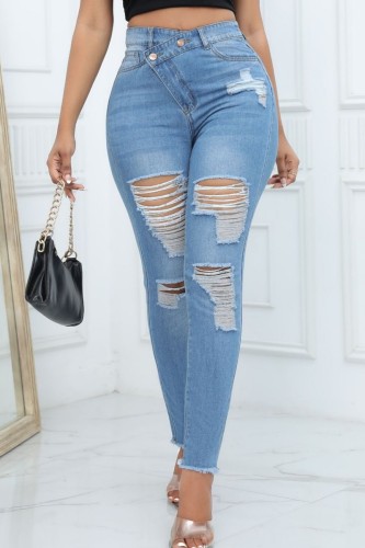 Jeans skinny casual azul claro com patchwork rasgado e cintura alta