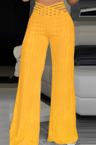 Calças de retalhos lisas casuais amarelas regulares de cintura alta convencionais de cores sólidas