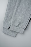 Ropa deportiva casual gris Patchwork sólido Cuello con capucha Manga larga Dos piezas