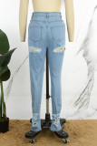 Lichtblauwe casual effen uitgeholde patchworkzak met knopen, ritssluiting, middentaille, normale denim jeans