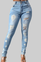 Ljusblå Casual Solid Ripped Patchwork Fickknappar Blixtlås med mitten av midjan Skinny denim jeans