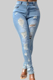 Ljusblå Casual Solid Ripped Patchwork Fickknappar Blixtlås med mitten av midjan Skinny denim jeans