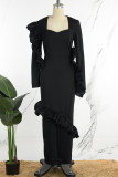 Vestido largo negro elegante de retazos lisos con orillo fibroso y cuello asimétrico