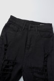 Zwarte straat effen gescheurde patchwork zak met knopen en rits, skinny denim jeans met hoge taille