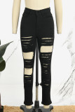 Zwarte straat effen gescheurde patchwork zak met knopen en rits, skinny denim jeans met hoge taille