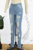 Lichtblauwe casual effen gescheurde patchworkzak met knopen en ritssluiting, skinny denim jeans met middentaille