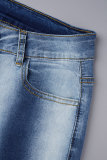Jeans in denim con taglio a stivale a vita media con bottoni e bottoni con tasca patchwork a righe blu