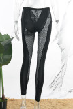 Pantaloni skinny convenzionali in tinta unita convenzionali a vita media con patchwork scavato nero sexy solido