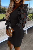 Zwarte elegante patchwork-jurken met V-hals en wikkelrok