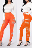 Pantaloni in tinta unita a matita a vita alta skinny casual arancioni con patchwork scavato solido