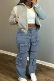 Hellblaue College-Jeans aus einfarbigem, Patchwork-Jeans mit Taschenknöpfen, Reißverschluss, mittlerer Taille und geradem Schnitt